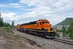 BNSF 1812 poses with part of the massive Coors Plant